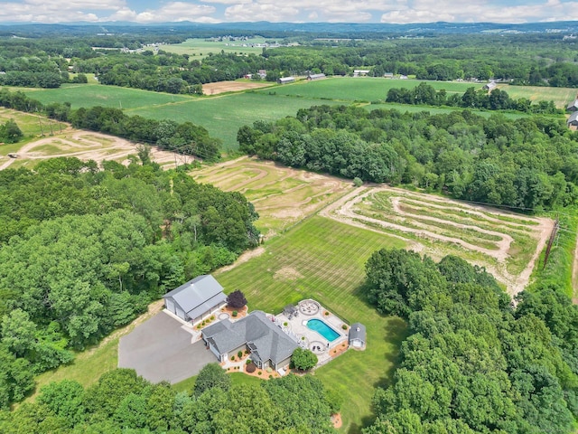 birds eye view of property with a rural view