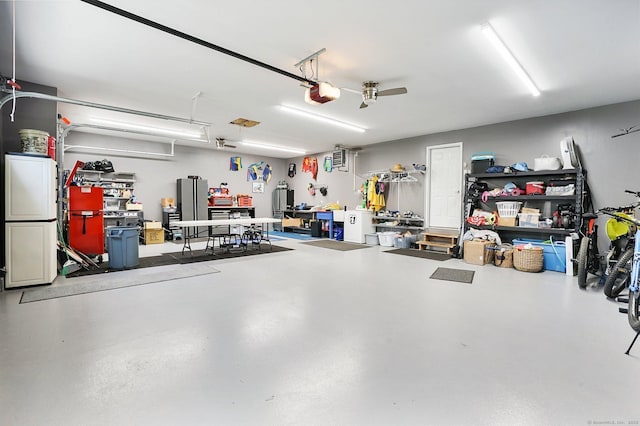 garage featuring a garage door opener and ceiling fan