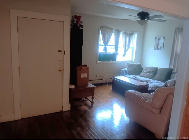 living room with hardwood / wood-style floors, ceiling fan, and a baseboard radiator