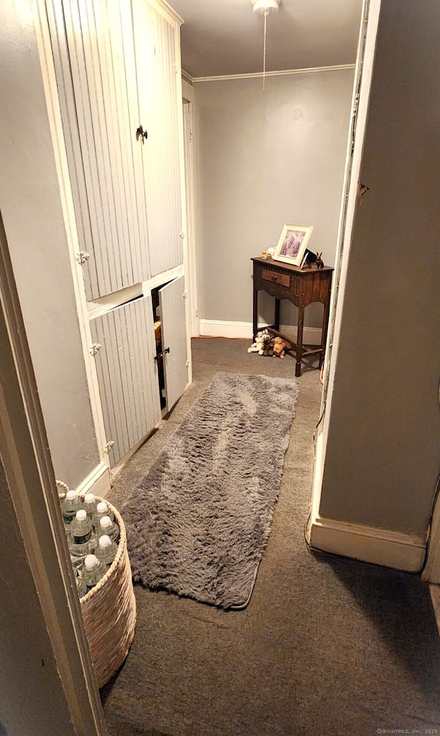 corridor with carpet and ornamental molding