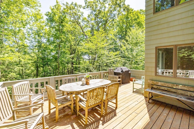 wooden deck with grilling area