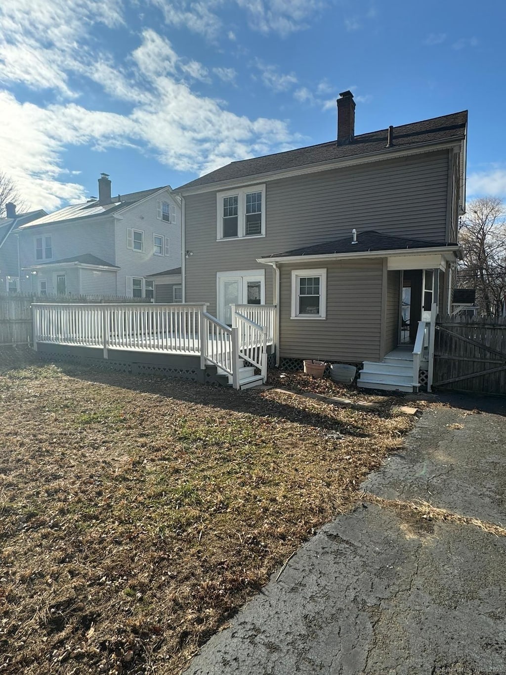 back of property with a deck