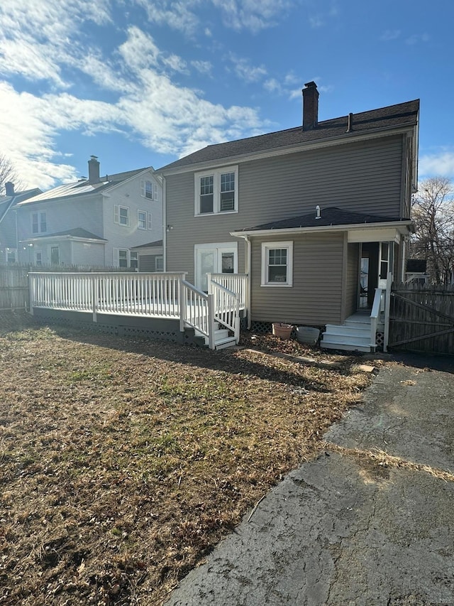 back of property with a deck