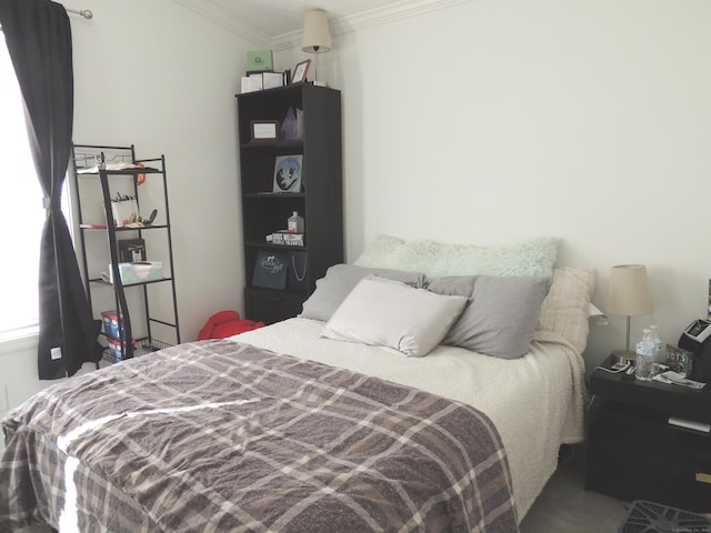 bedroom with crown molding