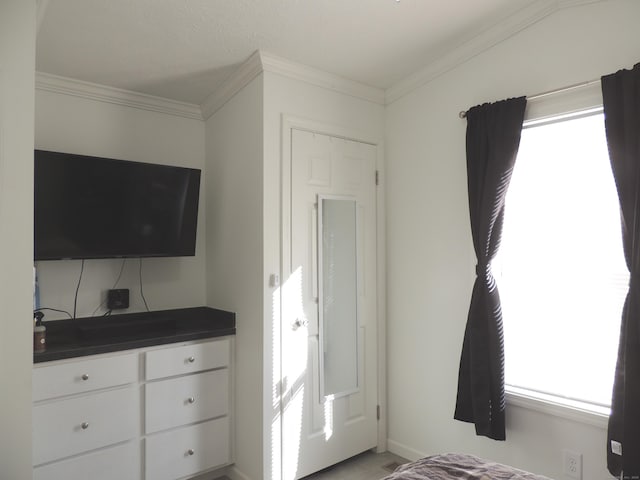 bedroom with crown molding