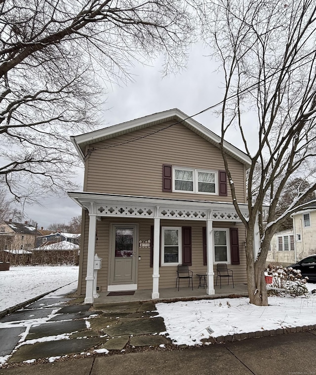 view of front property featuring covered porch