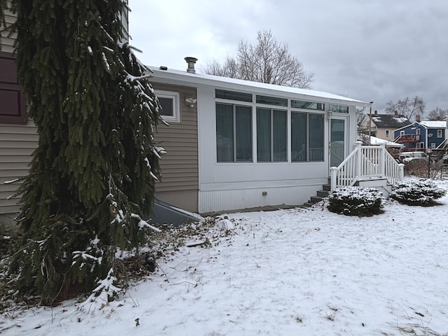 view of snow covered property