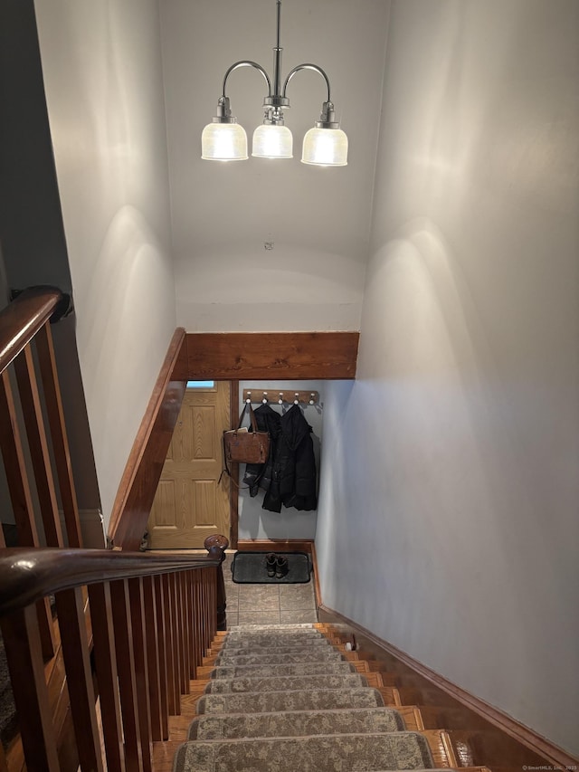 stairway with an inviting chandelier