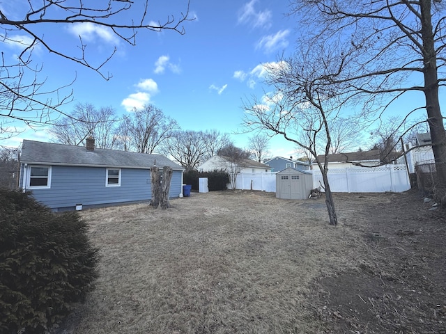 rear view of house featuring a storage unit