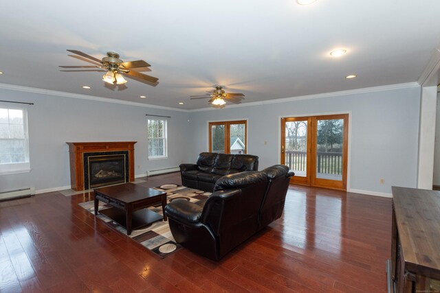 living room with ceiling fan, baseboard heating, and ornamental molding