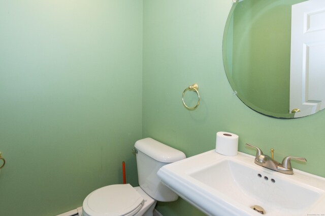 bathroom featuring sink and toilet