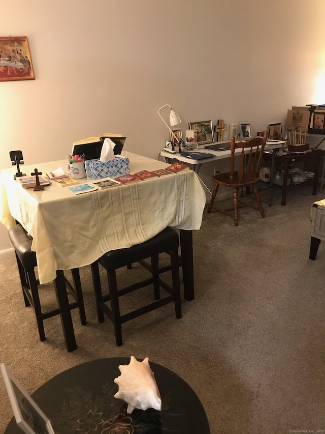 dining space with carpet