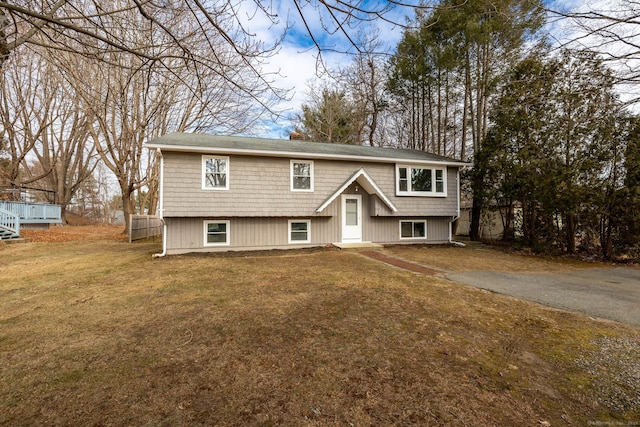 raised ranch featuring a front yard