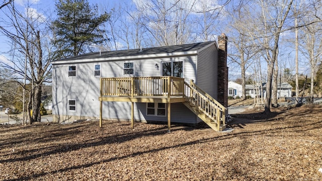 back of property featuring a wooden deck