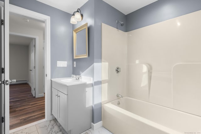 bathroom featuring shower / tub combination and vanity