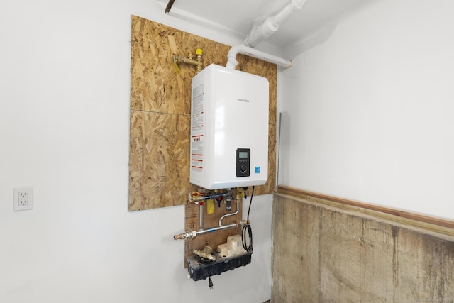 utility room featuring tankless water heater