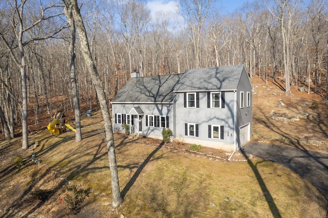 view of front of home featuring a garage and a front lawn