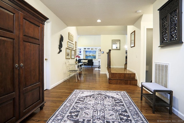 corridor featuring dark hardwood / wood-style flooring