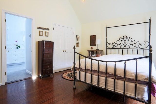 bedroom with dark wood-type flooring, high vaulted ceiling, and a closet