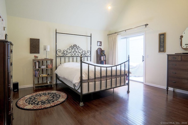 bedroom featuring dark hardwood / wood-style floors, vaulted ceiling, and access to outside