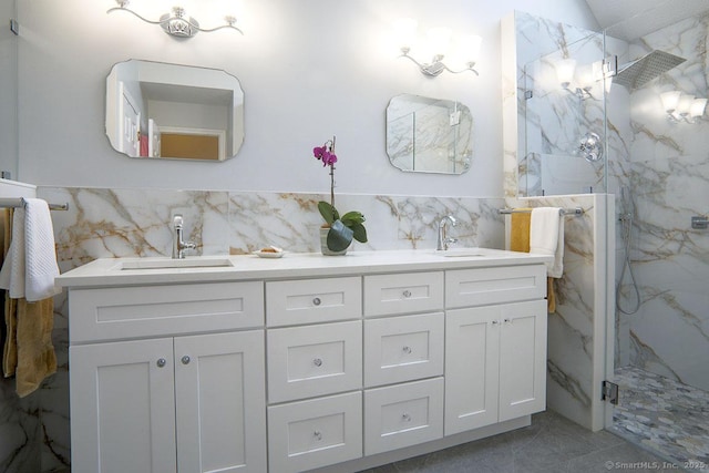 bathroom featuring vanity, tile walls, and walk in shower