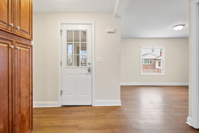 doorway to outside with light hardwood / wood-style floors