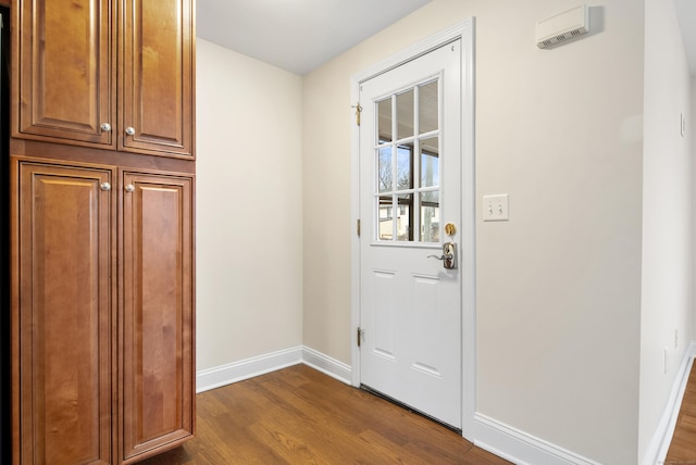 doorway with dark hardwood / wood-style floors