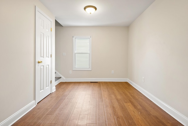 unfurnished room with light hardwood / wood-style flooring