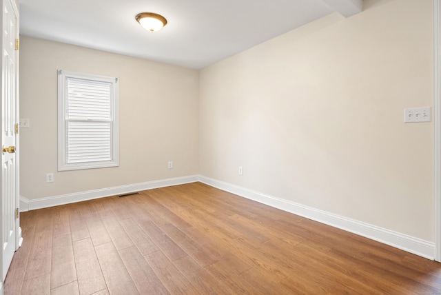 unfurnished room with light hardwood / wood-style flooring