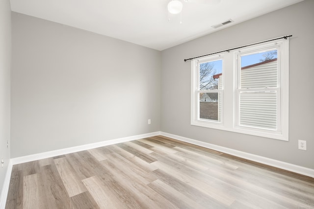 spare room featuring ceiling fan and light wood-type flooring