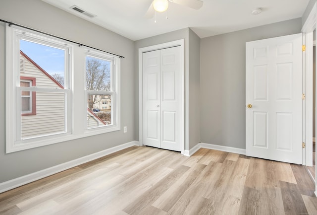 unfurnished bedroom featuring a closet, ceiling fan, and light hardwood / wood-style floors