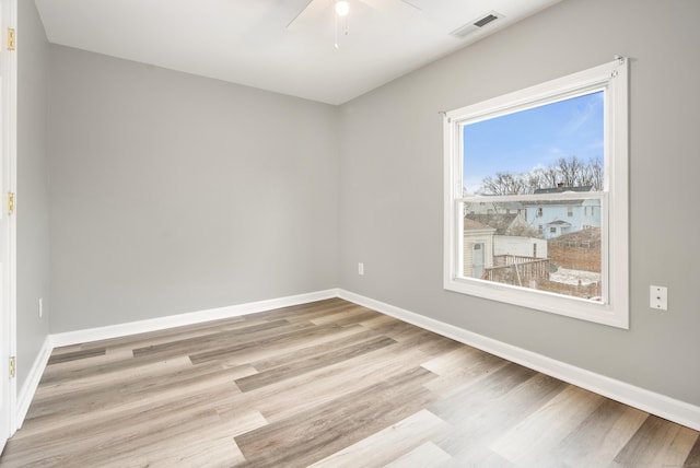 spare room with ceiling fan and light hardwood / wood-style floors