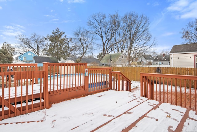 snow covered deck with a covered pool