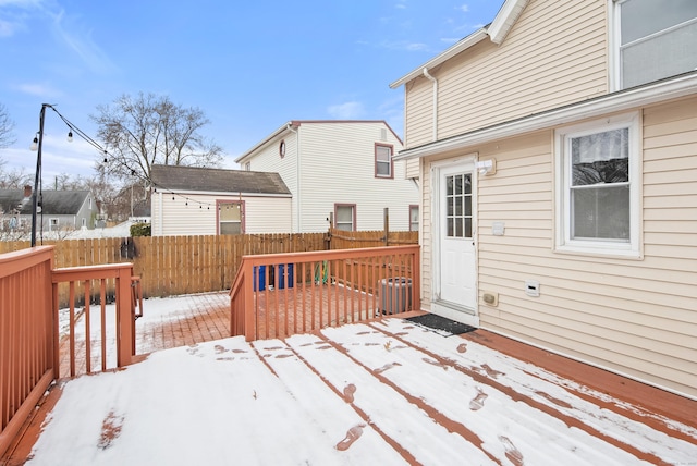 snow covered deck featuring central AC