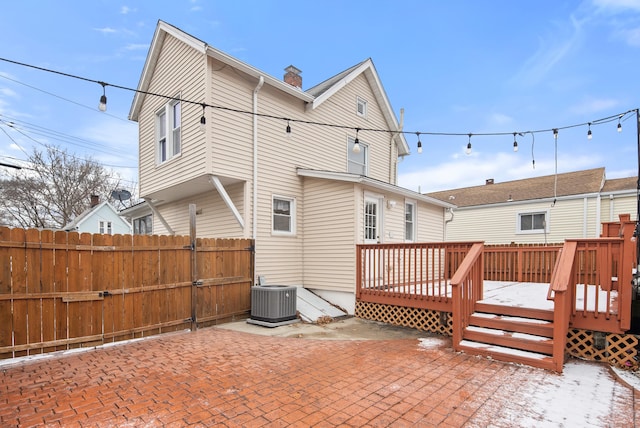 rear view of property featuring a patio area, central AC unit, and a deck