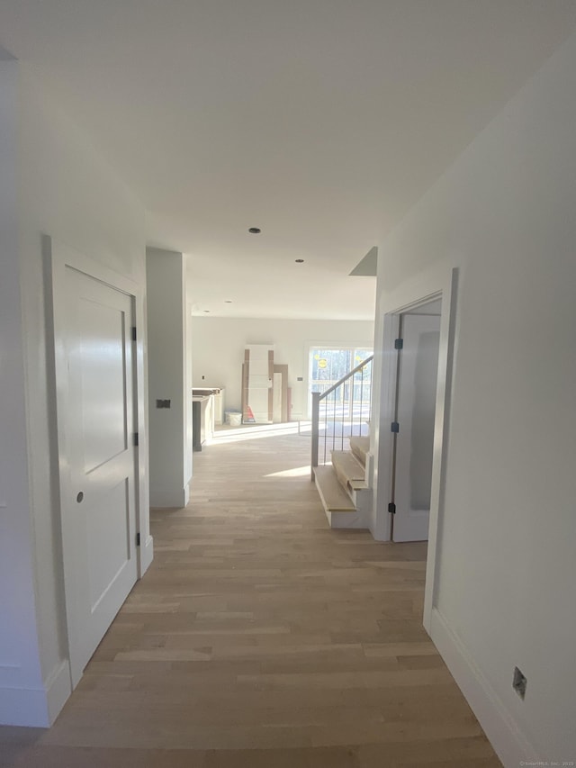 hallway with wood-type flooring