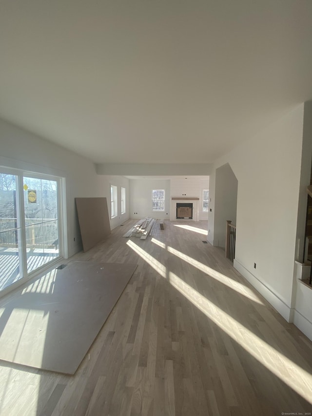 unfurnished living room with hardwood / wood-style floors