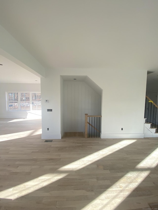 additional living space with light wood-type flooring