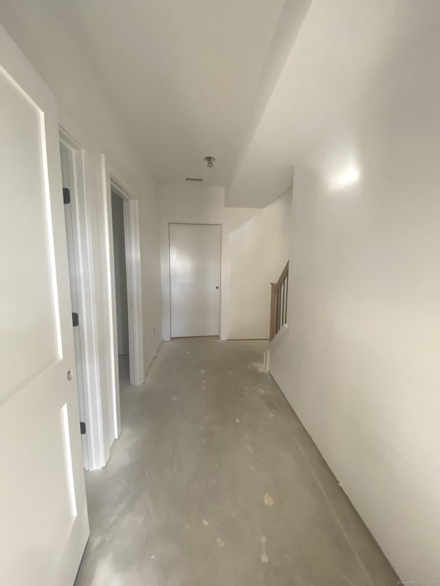 corridor with concrete flooring