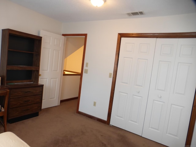 bedroom featuring a closet and carpet