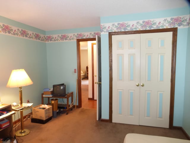 bedroom with a closet and carpet