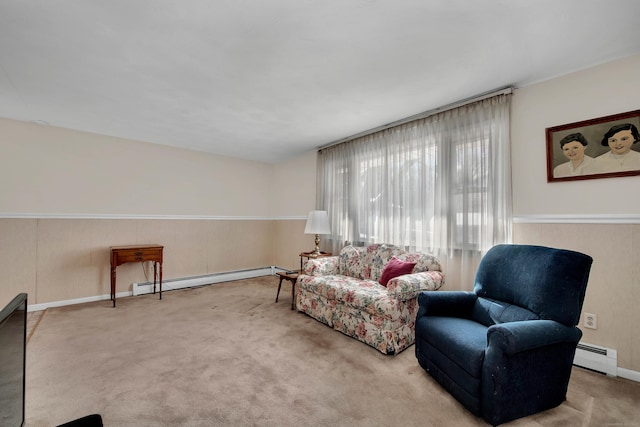 living area with carpet floors and a baseboard heating unit