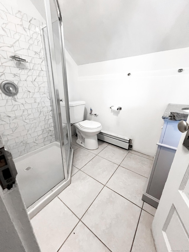 bathroom featuring tile patterned floors, toilet, a shower with shower door, and a baseboard heating unit