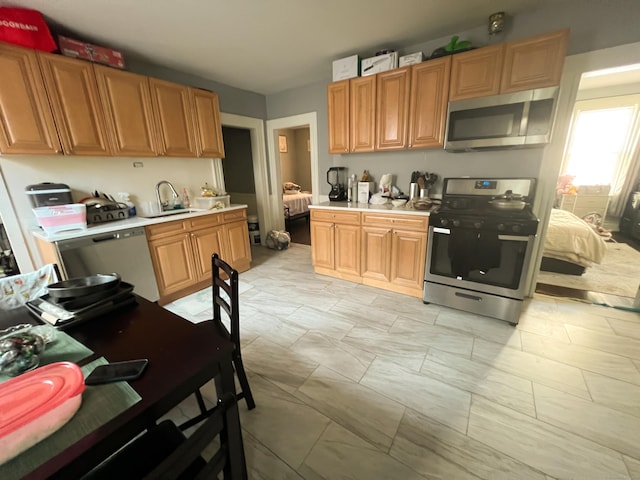 kitchen featuring sink and appliances with stainless steel finishes