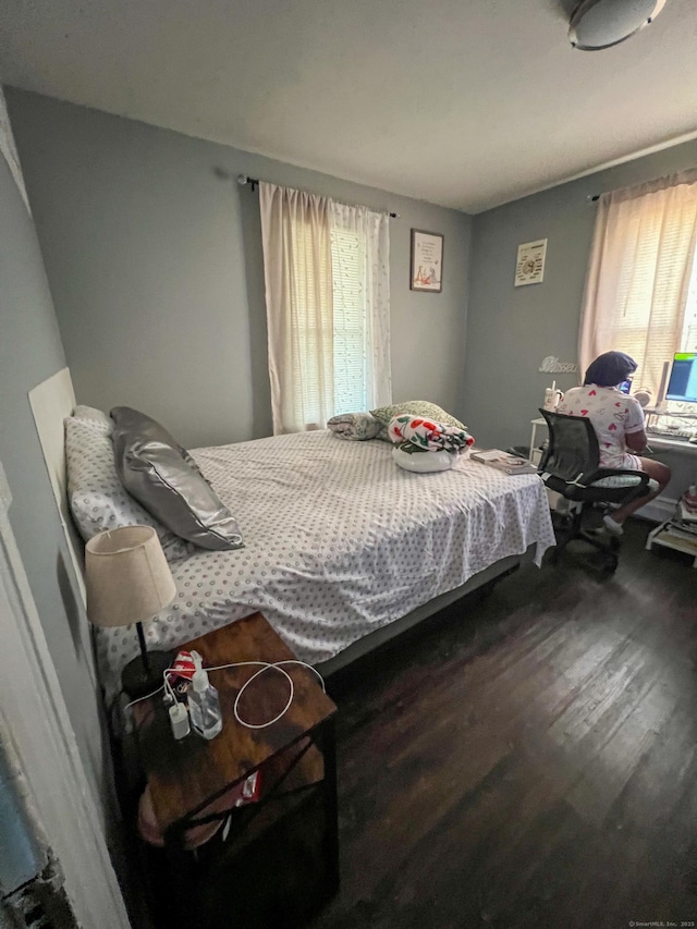 bedroom featuring wood-type flooring