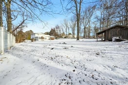 view of yard layered in snow