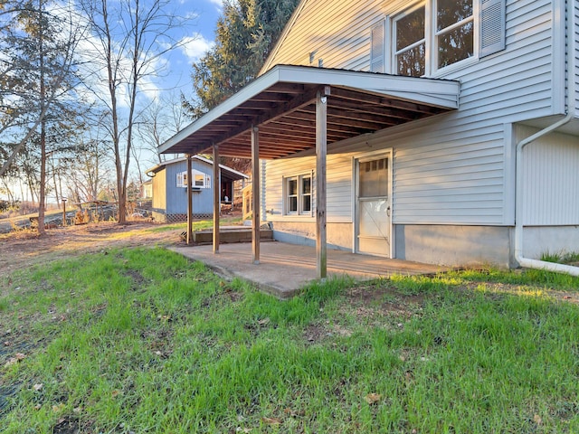 exterior space featuring a storage unit and a yard