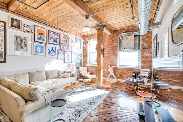 living room featuring wooden ceiling, dark hardwood / wood-style flooring, beamed ceiling, and brick wall