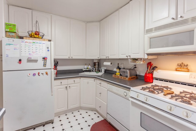 kitchen with white cabinetry, white appliances, and sink