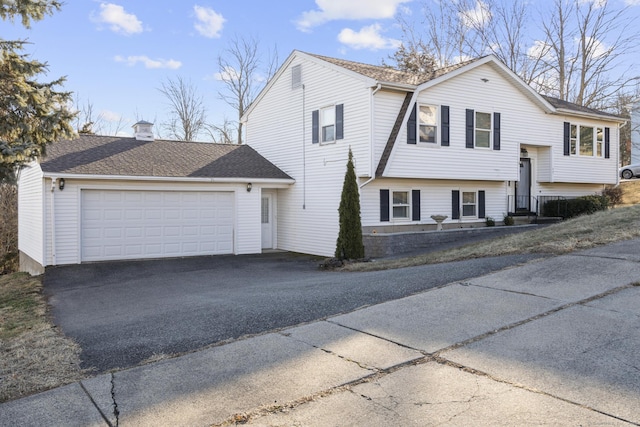 raised ranch featuring a garage